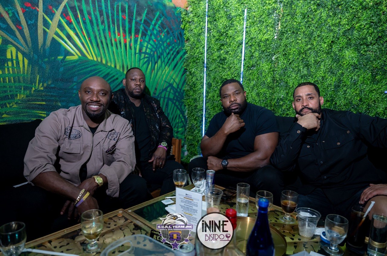 Bosses at the table by the mural